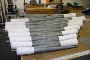 Gray metal organ pipes with white wrappings