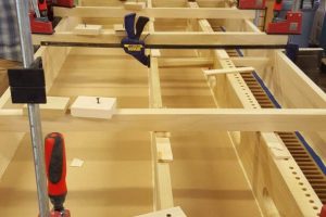 Clamped organ chest assembly with wooden blocks