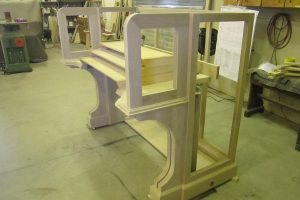 Unfinished oak organ console frame in shop